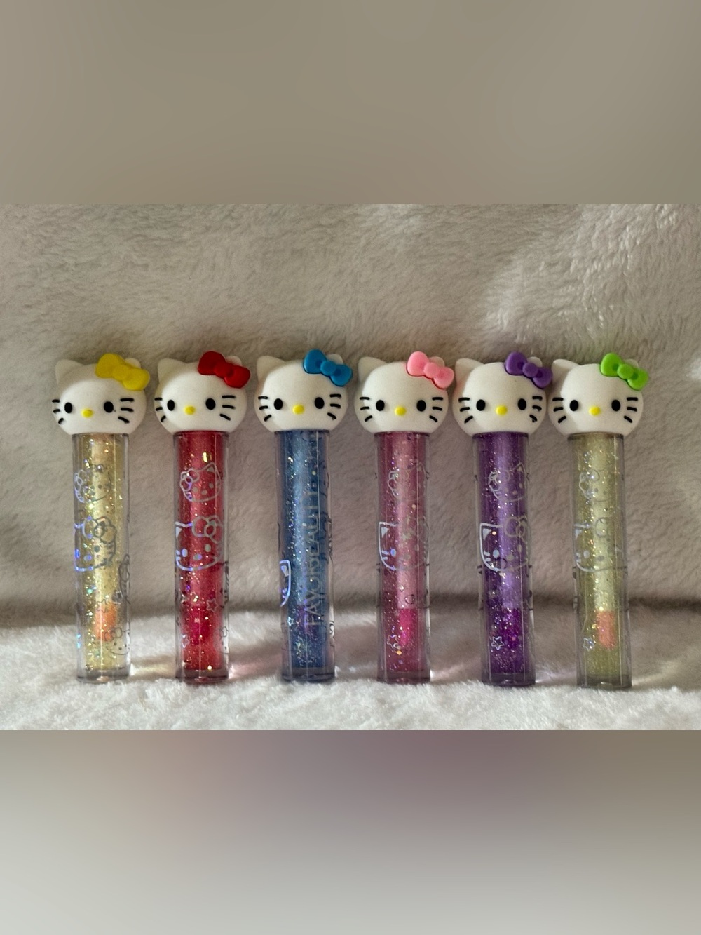 Hello Kitty Glitter Lip Gloss Set in Yellow, Red, Blue, Pink, Purple & Green